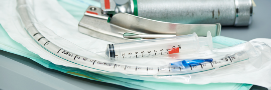 An endotracheal tube, a laryngoscope, and a syringe