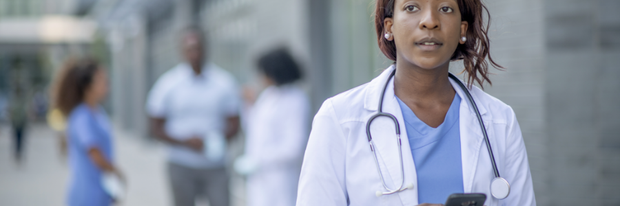 A young doctor on her smartphone