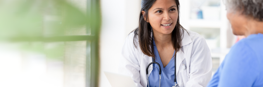 A physician speaking with a patient