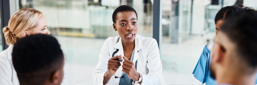 Doctor speaking to her colleagues