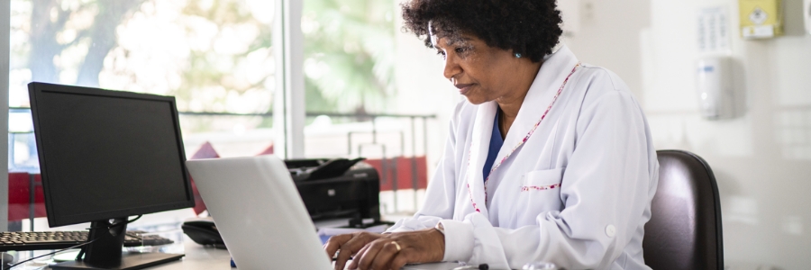 A female physician using a laptop