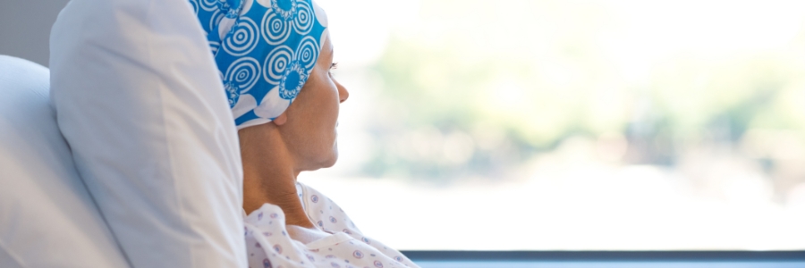 A female chemotherapy patient in bed