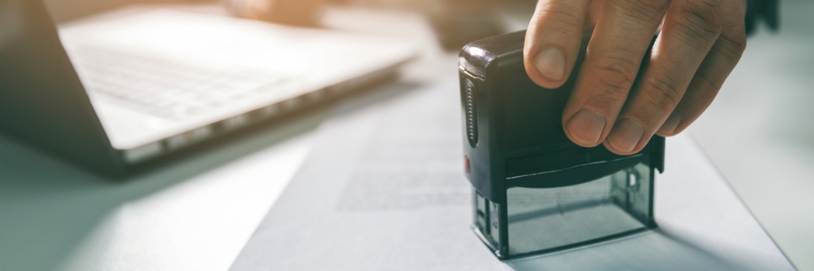 A stamp being applied to a document