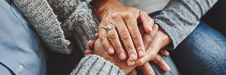 Holding the hand of an elderly person