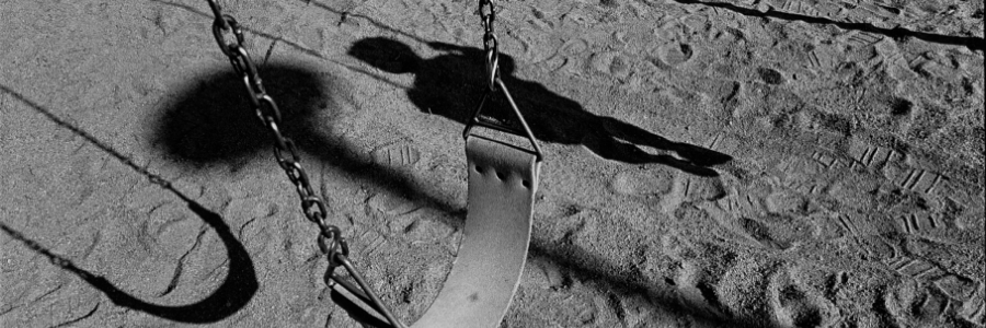 Empty swing at children's playground