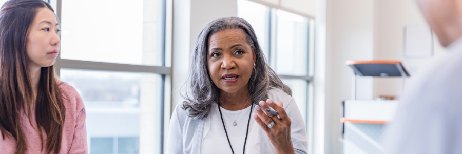 Physician speaking to a group of patients