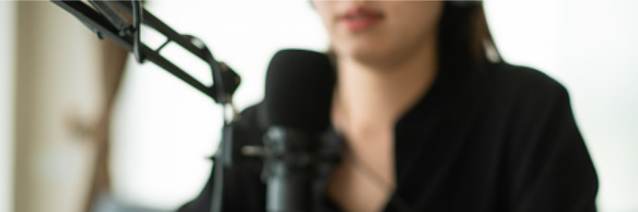 Woman behind a microphone