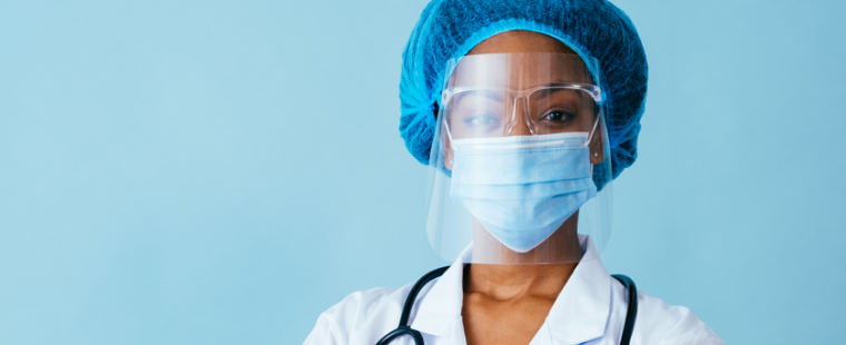 Medical professional wearing a face mask and shield