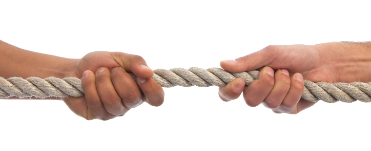 Close up of tug-of-war with two hands.