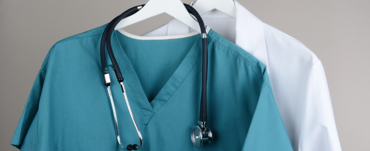 Medical scrubs hanging up with a stethoscope