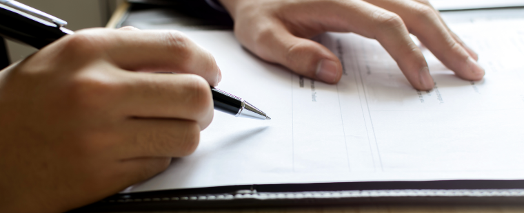 Judge signing a document