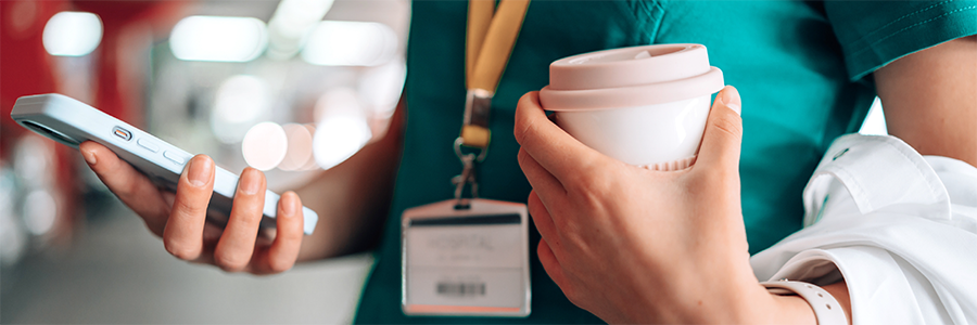 Healthcare professional reviewing information on a mobile device.