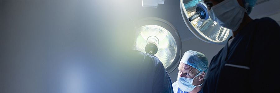 Surgeons working in operating room.