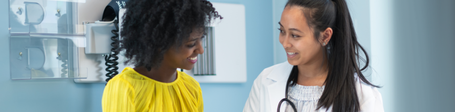 A physician consults with her patient. 