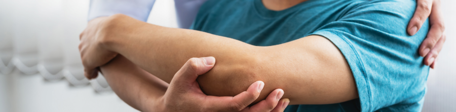 A physician assessing a patient’s arm issue