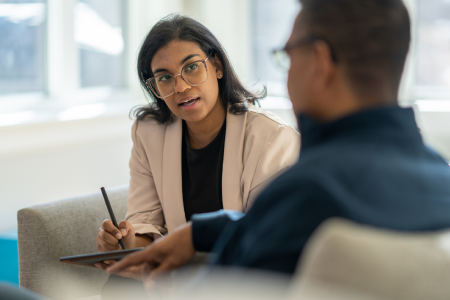 A psychiatrist consults with a patient.